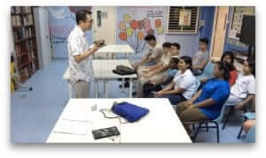 Cheen Tan teaches a group of teens in Singapore.