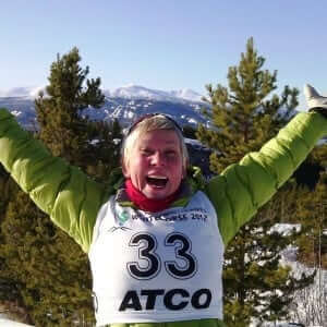 Christine Klaassen St. Pierre finishes a joyful snowshoe race on top of a snowy Canadian mountain. 